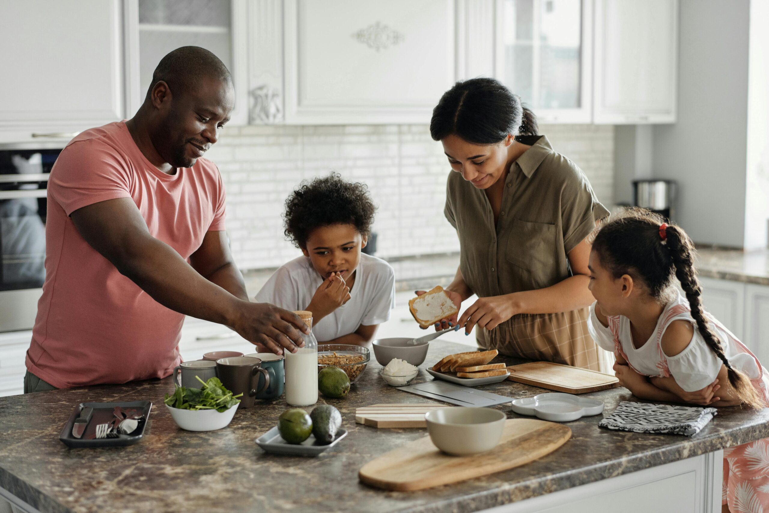 Family cooks together in the kitchen